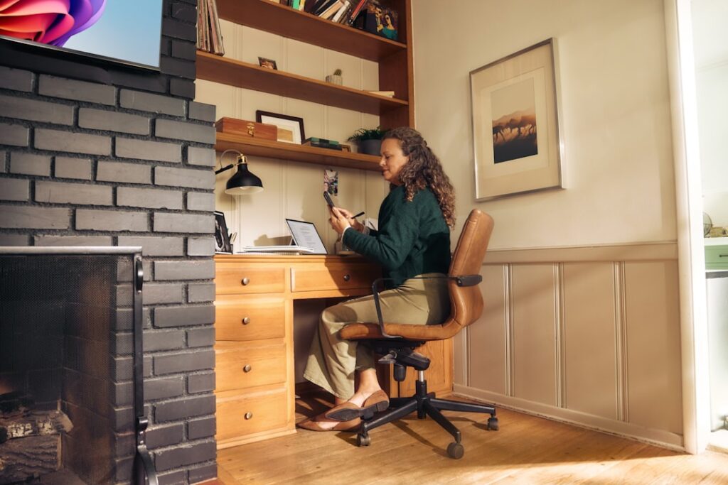 Woman working at a desk in a cozy home office