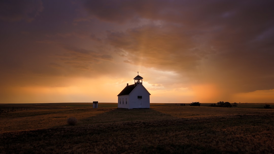 a house with a sunset in the background