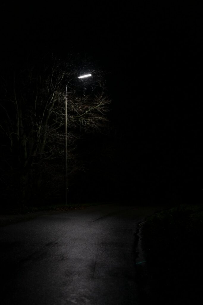 view of empty road under light post